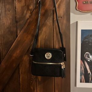 Chic Black Crossbody Bag with Gold Accents
